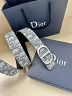 Dior belt with light blue-gray monogram strap and silver round buckle