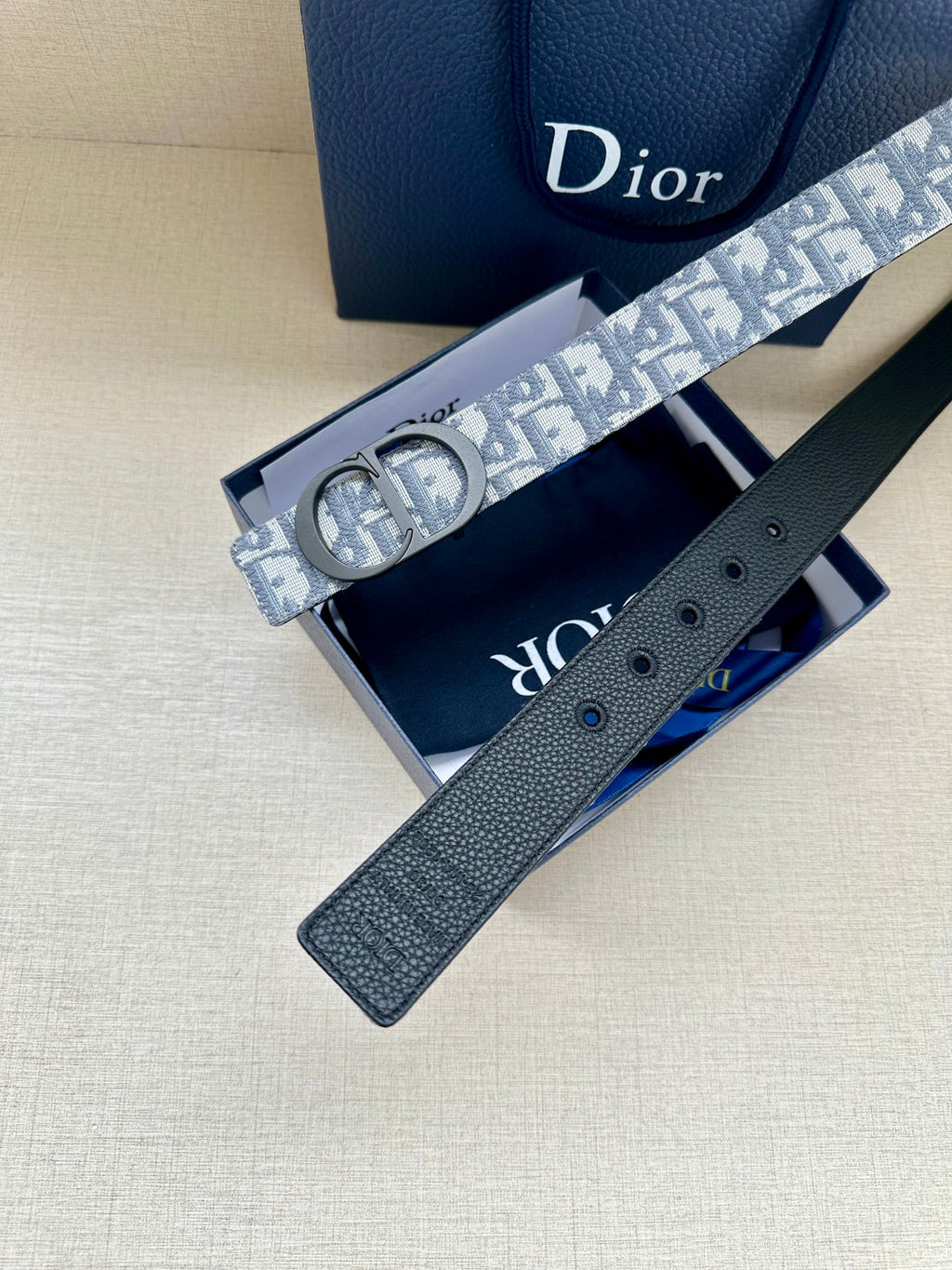 Monogram belt with reversible dark leather strap, blue-gray patterned strap shown open
