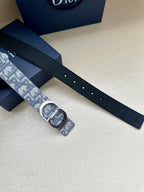 Dark leather belt strap with holes and jacquard buckle keeper