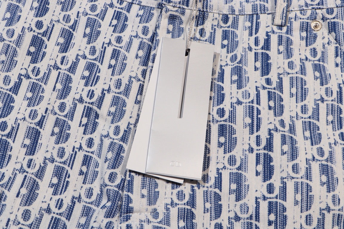 Dior shorts with hanging white size tag on blue print