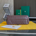 Burgundy patterned Goyard tote bag with wide base and top zipper closure.
