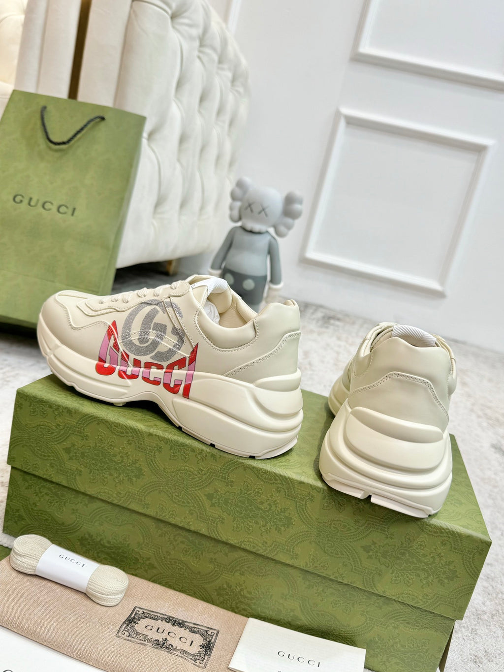 Gucci unisex off-white sneakers, side and heel view, lace-up with branded print