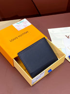 Small leather wallet with embossed logo, compact folded style, dark navy