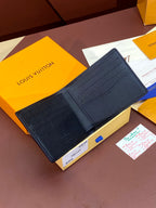 Small leather wallet interior view with card slots, stitched edges