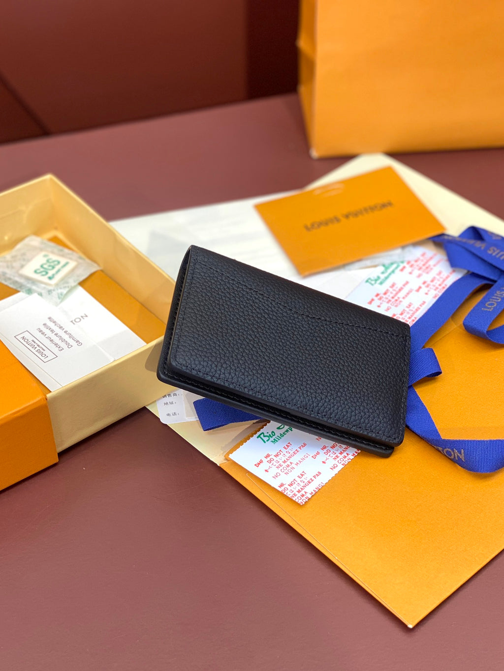 Dark blue leather small wallet with flap and LV logo