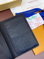 Dark blue leather wallet interior with stitched card slots and LV stamp