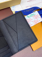 Dark blue leather wallet interior showing card compartments and seams