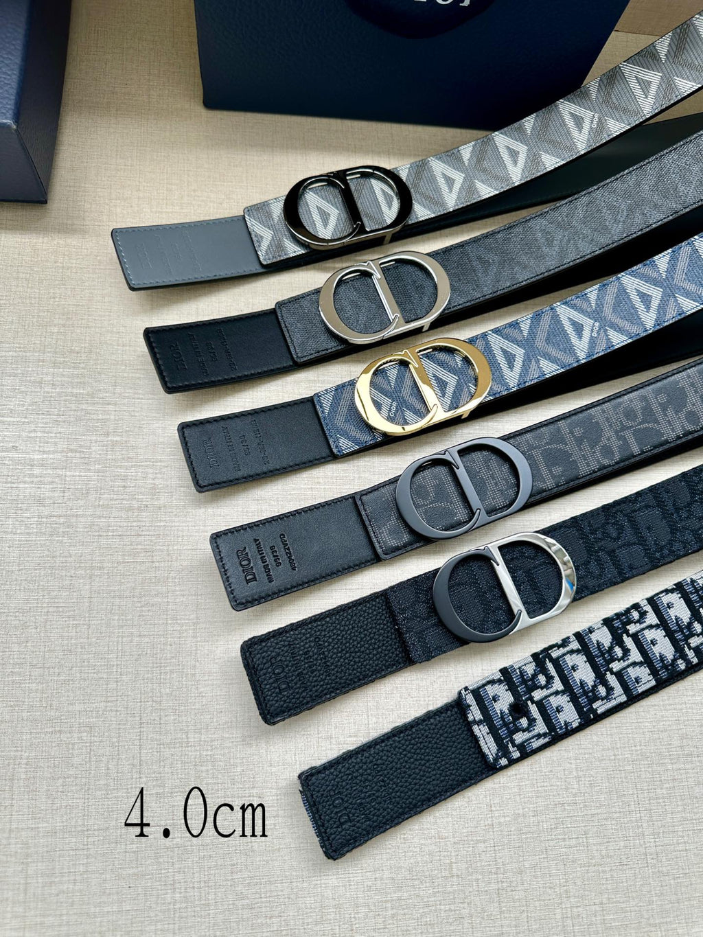 Dior belts set with different straps and oval D buckles, including patterned and solid styles