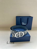 Dior belt with gray geometric strap, round logo buckle, and blue leather backing