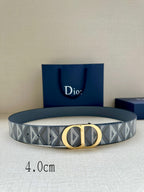 Designer belt by Dior: gray-blue monogram strap with gold CD buckle.
