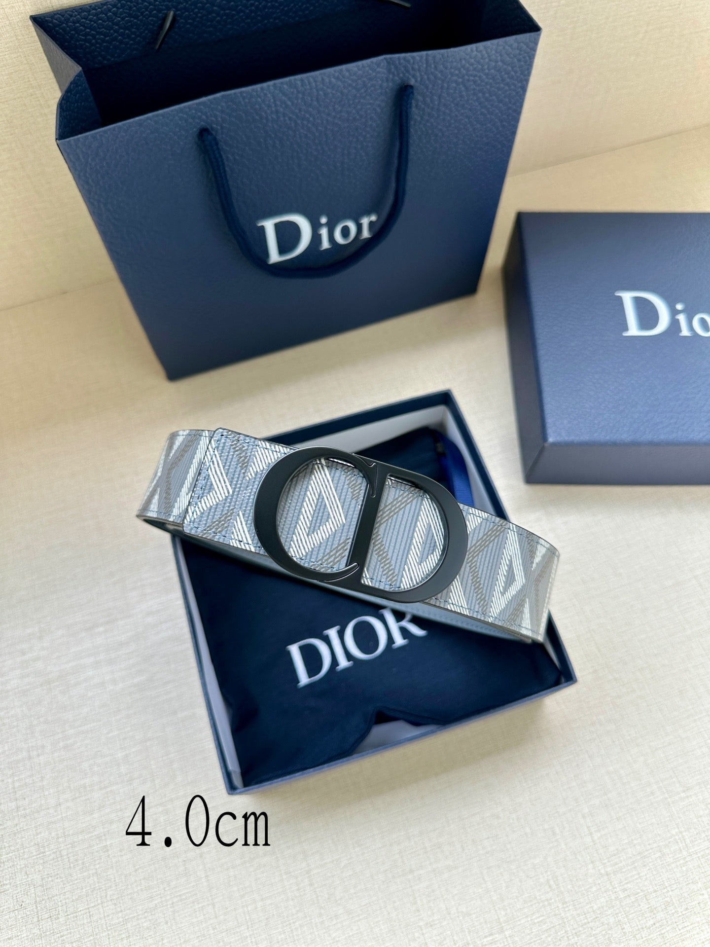 Dior belt, patterned light blue strap with black buckle and silver Dior logo