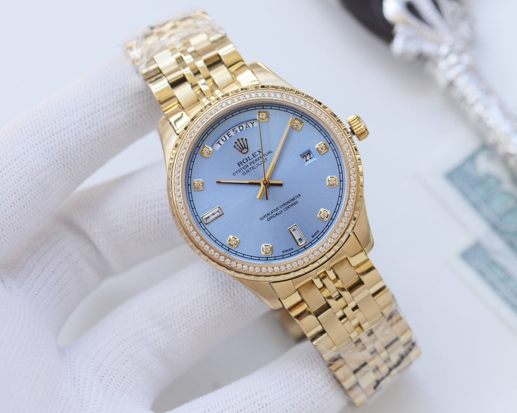 Rolex gold wristwatch with diamond bezel and gold-tone link bracelet, blue dial