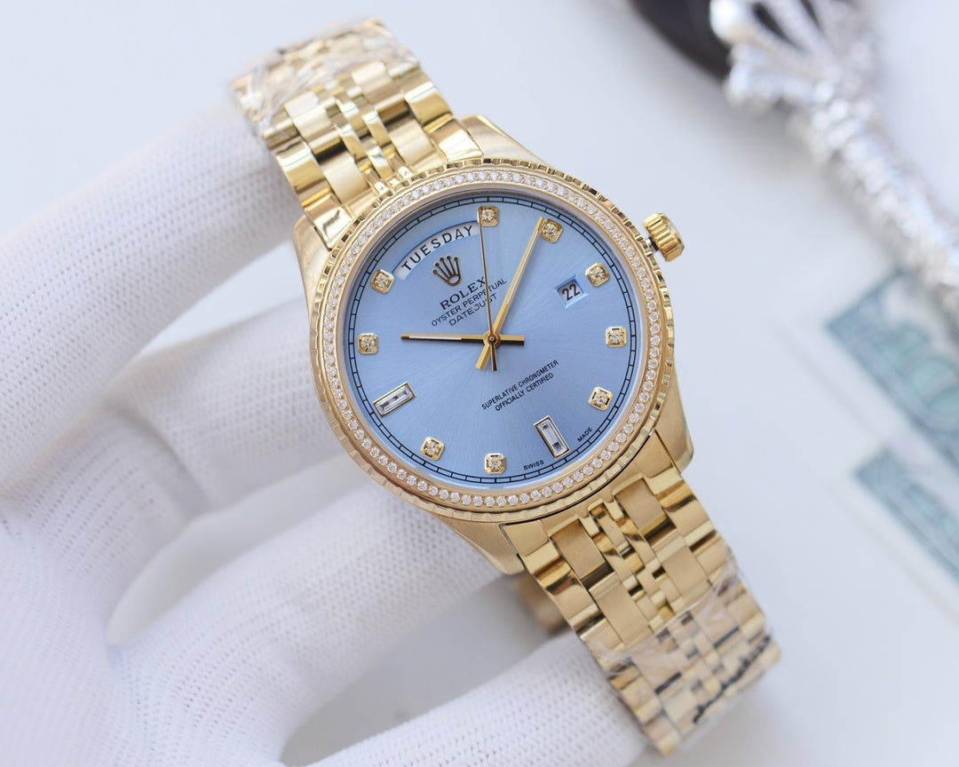 Rolex gold wristwatch with diamond bezel and gold-tone link bracelet, blue dial
