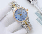 Rolex two-tone wristwatch with diamond bezel and mixed metal link bracelet, blue dial