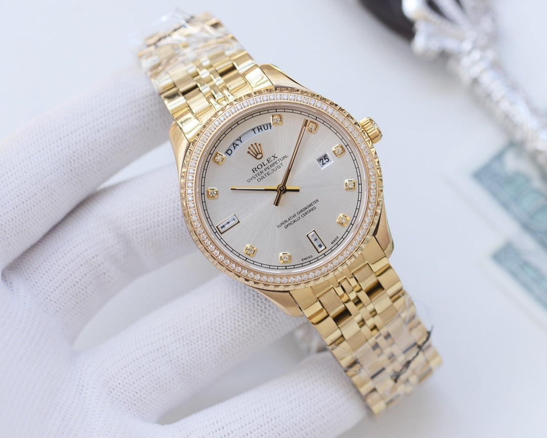 Rolex gold wristwatch with diamond bezel and gold-tone link bracelet, white dial