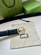 Dark blue Gucci belt with gold logo buckle and fabric dust bag