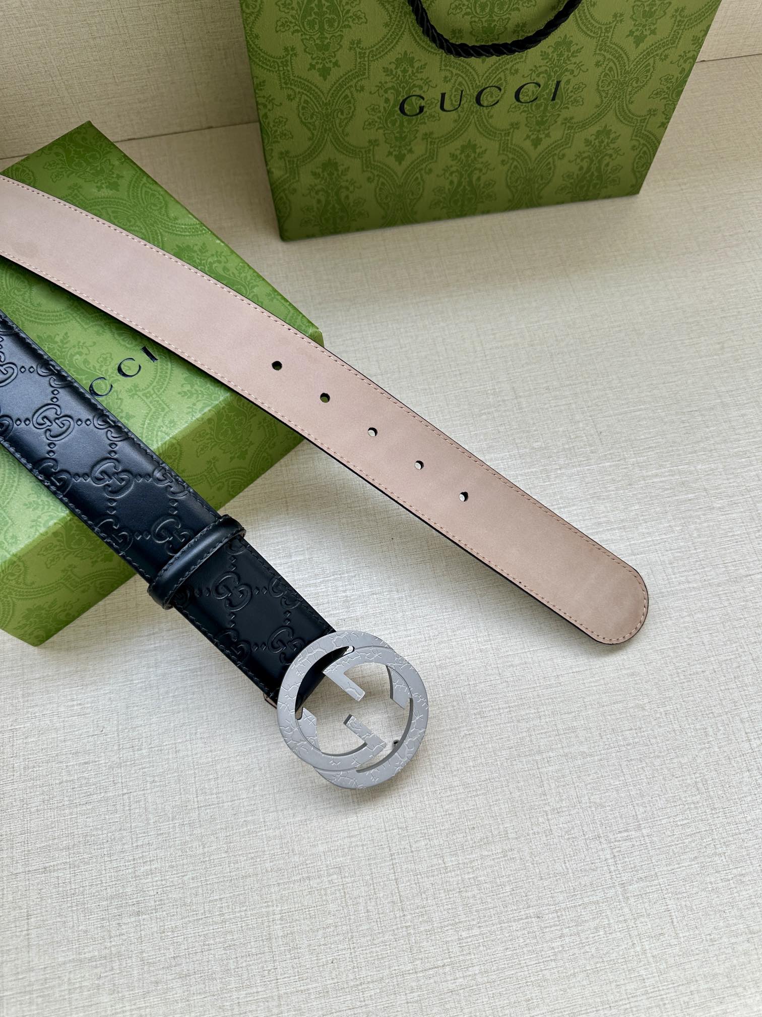 Gucci belt underside: pale interior leather with punched holes and silver-tone buckle