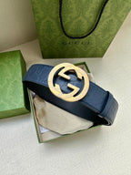 Gucci belt with dark blue strap and gold-tone GG buckle
