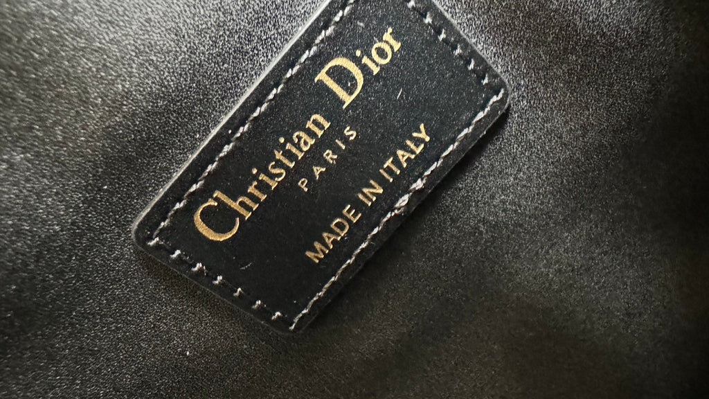 Dior interior label on black leather, “Christian Dior” and “Made in Italy”