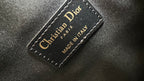 Dior interior label on black leather, “Christian Dior” and “Made in Italy”