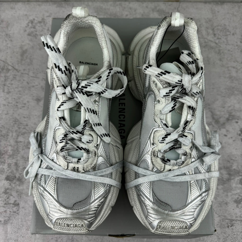 Balenciaga silver lace-up sneakers, rear view on a box