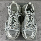 Balenciaga silver lace-up sneakers, rear view on a box