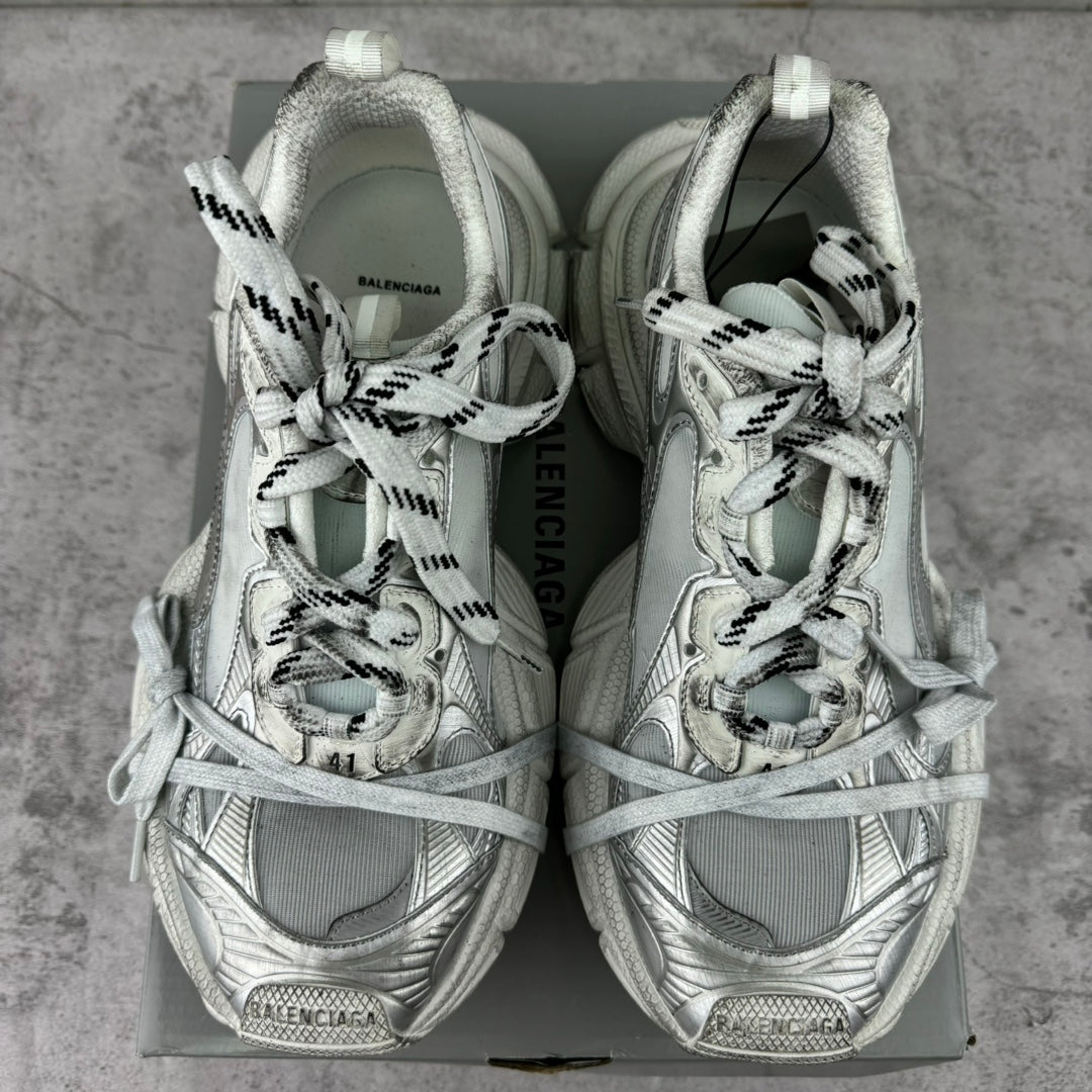 Balenciaga silver lace-up sneakers, rear view on a box