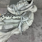 Balenciaga silver lace-up sneakers, close-up of side panels and laces