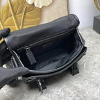 Prada black leather bag interior view with zip pocket and lining; hardware visible.