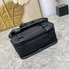 Prada black leather crossbody bag with dual front buckles and top handle straps.