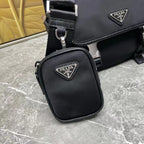 Prada black leather crossbody bag with flap and small pouch; silver logo hardware.