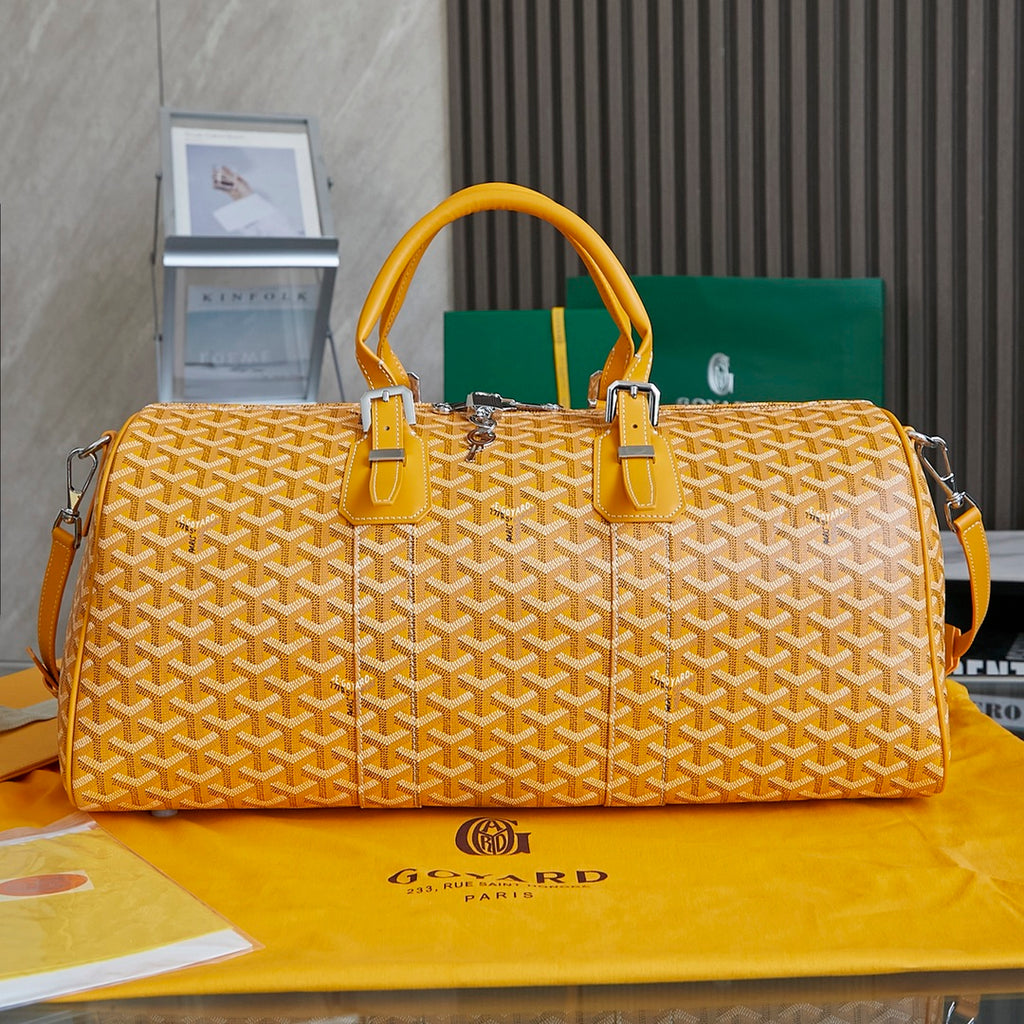 Goyard duffel bag, yellow patterned canvas, leather handles, shoulder strap