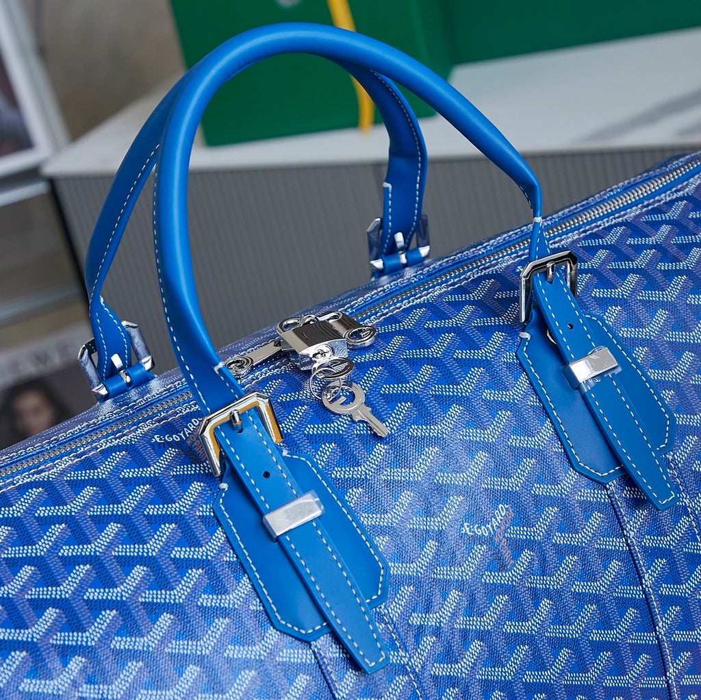 Goyard blue monogram duffle bag top view with handles and strap attachments
