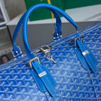 Goyard blue monogram duffle bag top view with handles and strap attachments