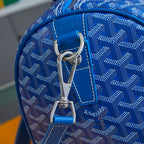 Goyard blue monogram duffle bag close-up: top handle and metal clip