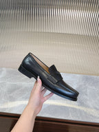 Prada unisex black loafer with chunky low heel, side profile view