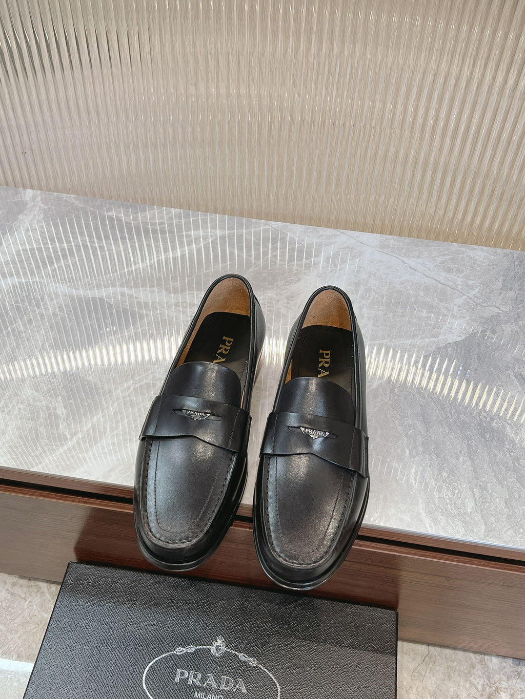 Prada unisex black loafers with strap detail, rounded toe