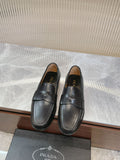 Prada unisex black loafers with strap detail, rounded toe