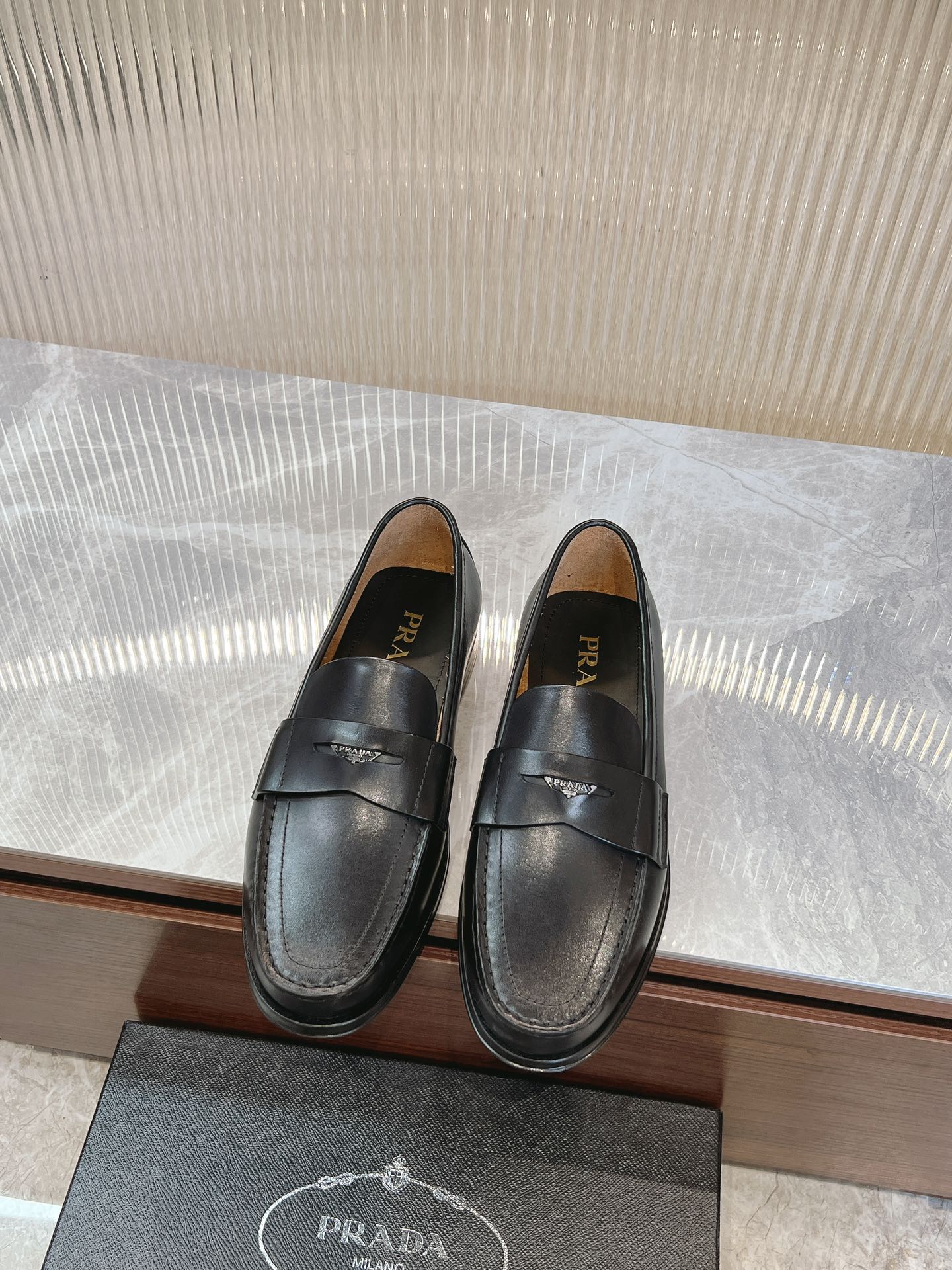Prada unisex black loafers with strap detail, rounded toe