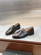 Prada unisex leather loafers, dark brown, angled view with stitched trim