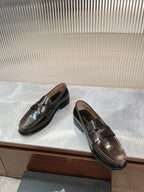 Prada unisex leather loafers, dark brown, side view with penny strap