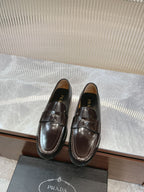 Prada unisex leather loafers in dark brown with penny strap and glossy finish