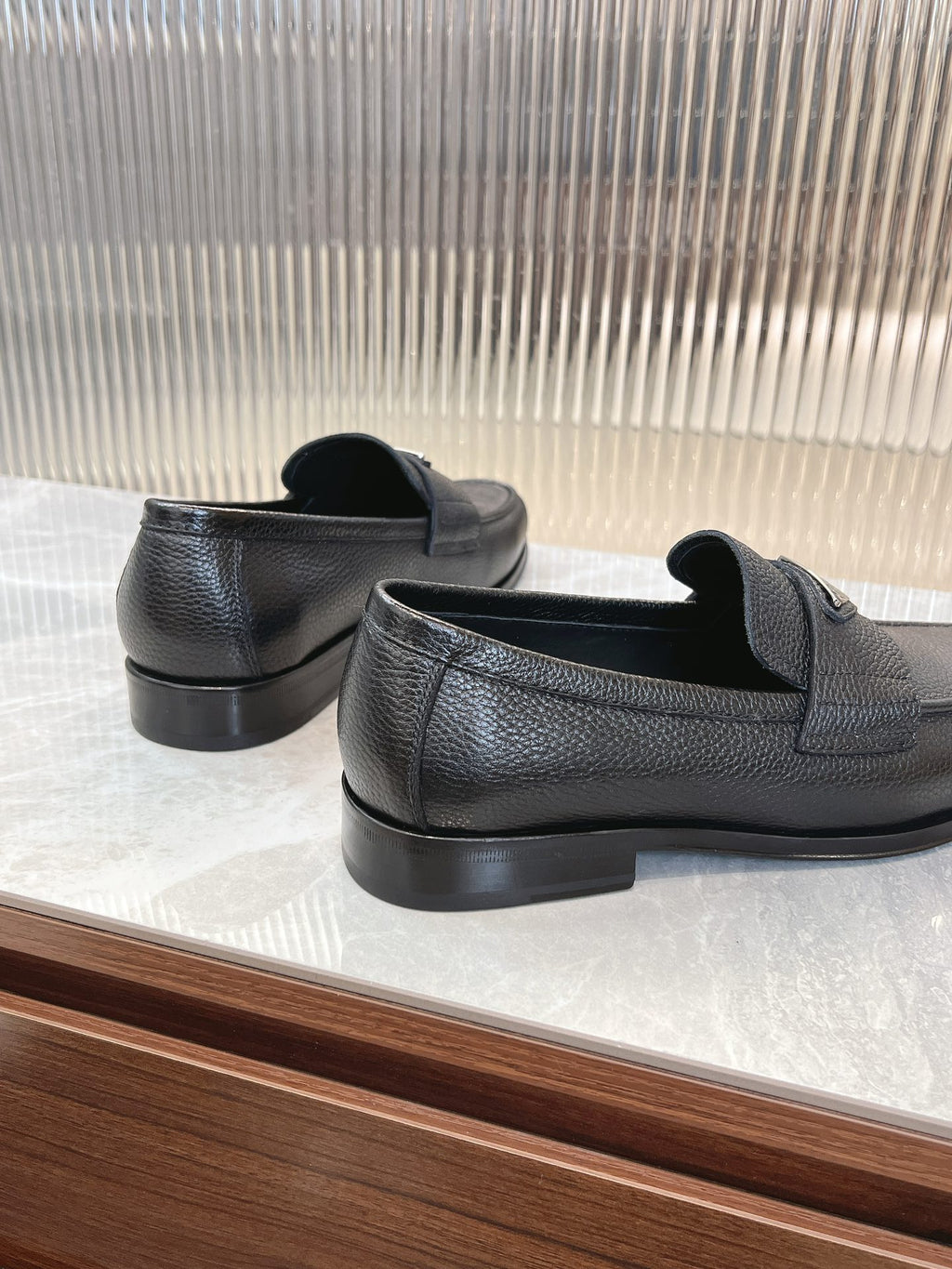 Prada unisex loafers, dark leather with heel and back slip-on collar detail
