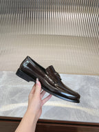 Dark brown leather Prada loafer with metal bit detail and low heel