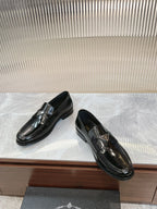 Prada unisex loafers, dark patent leather, side view with metallic buckle