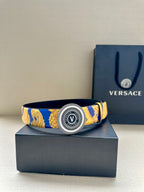 Belt with gold-and-blue baroque print and round Versace logo buckle, front view.