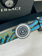 Versace belt close-up: teal-blue patterned strap with circular silver buckle