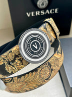 Versace belt buckle close-up: round V logo with textured gold baroque strap