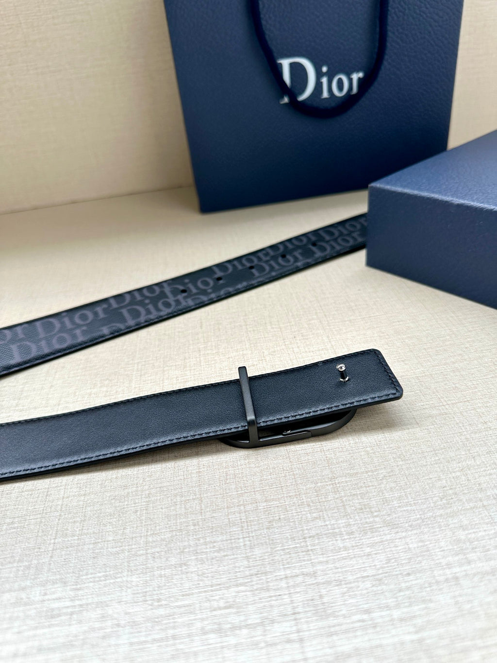 Dior belt with smooth dark blue leather strap and rectangular buckle keeper