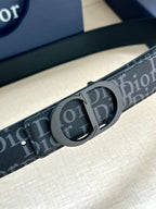 Dior belt strap close-up with repeating Dior logo and round buckle